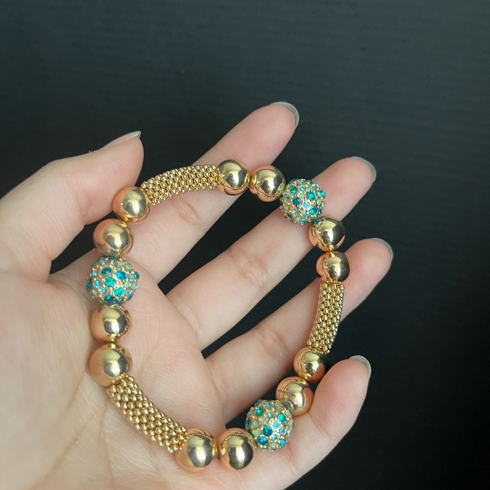 Gold tone metal stretchy cz metallic bead bracelet